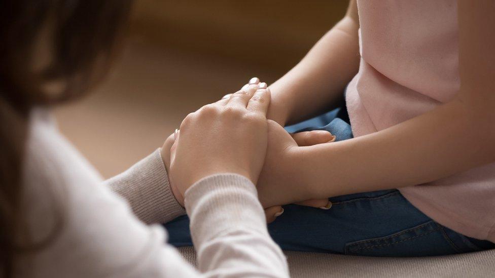 Stock image of girl being comforted