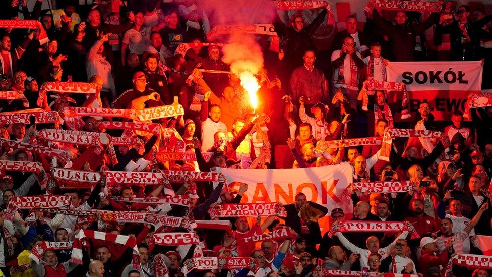 Flare among Poland fans at the Cardiff City Stadium