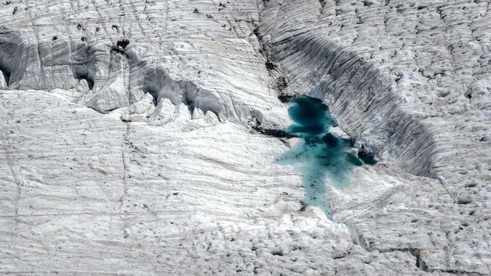 Water on a melting glacier next to Gorner ridge on the Swiss alps