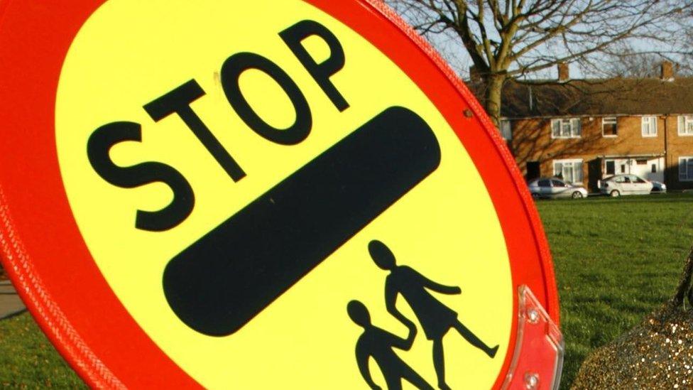 Picture of a school crossing patrol stop sign