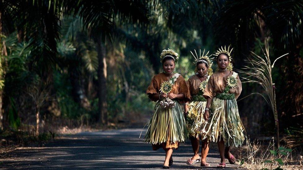 Malaysian women from the indigenous Mah Meri tribe wear traditional costumes on 1 March 2014.