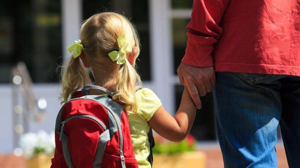 Child being holding parent's hand