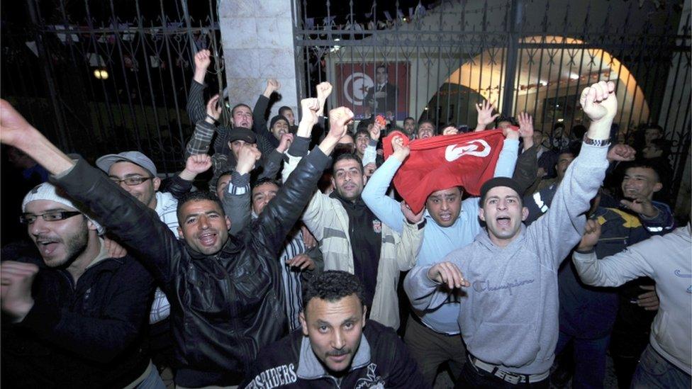 People in Tunis celebrate the announcement that President Zine El Abidine Ben Ali is to stand down