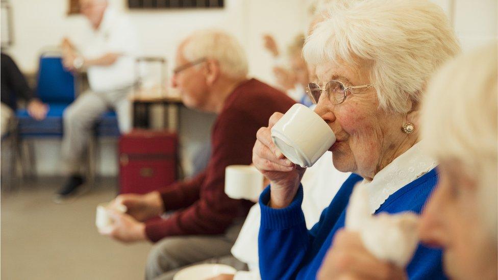 Pensioner drinking tea