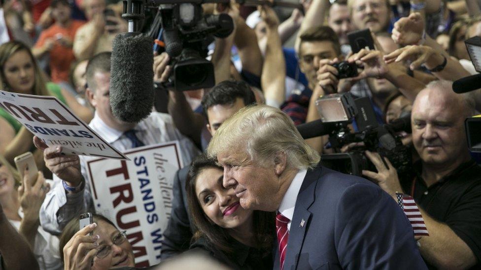 US Republican presidential candidate Donald Trump greets supporters after a campaign rally at the American Airlines Center in Dallas