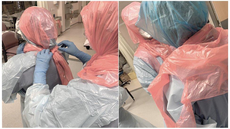 Photo of Dr Roberts helping her colleagues by securing bin bags on their heads