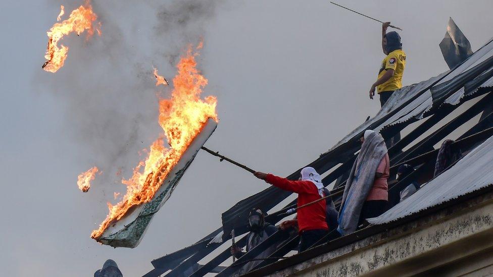 Prisoners protesting on the roof of Villa Devoto prison in Buenos Aires earlier this week after its first Covid-19 case was diagnosed