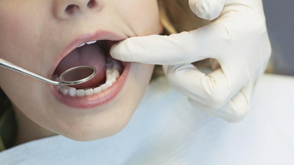 Child being seen by dentist