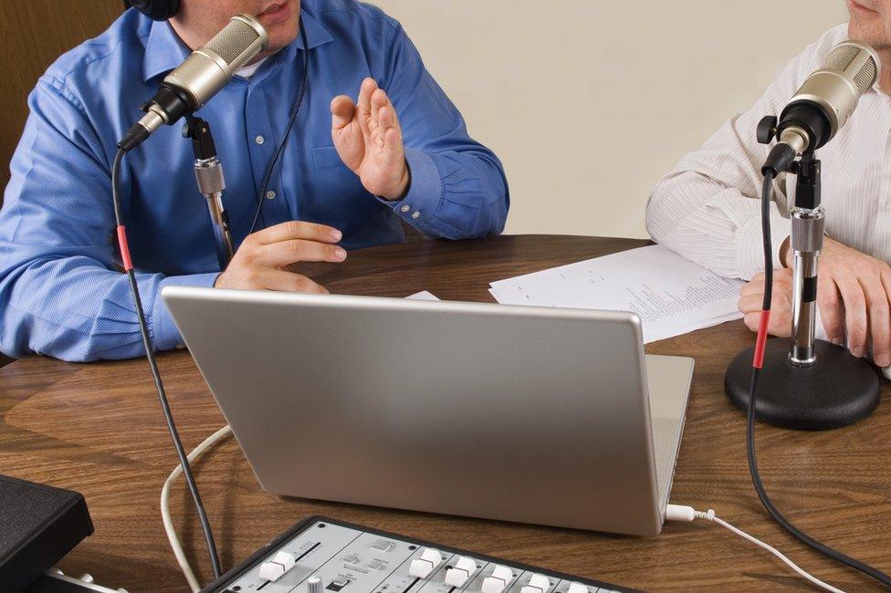 Podcasting with a laptop and microphones