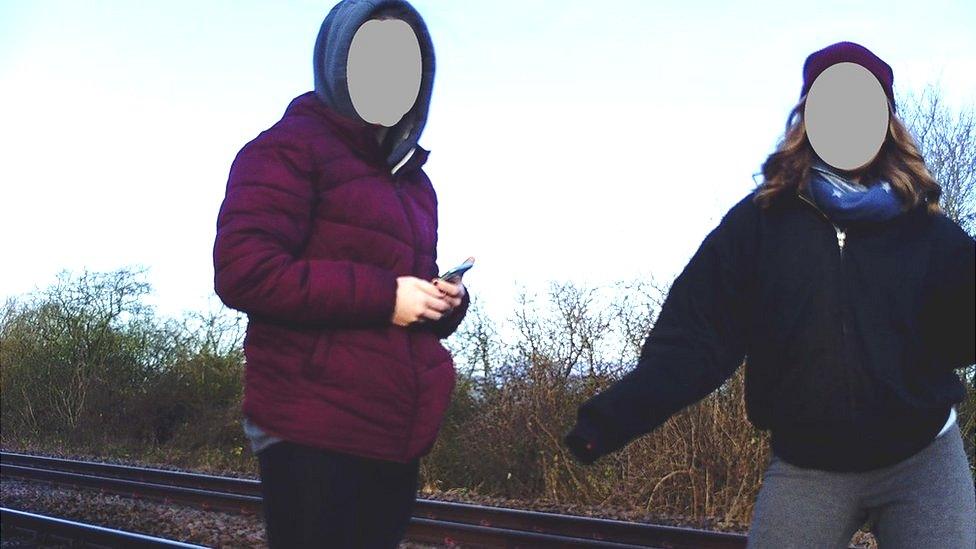 Girls on railway track