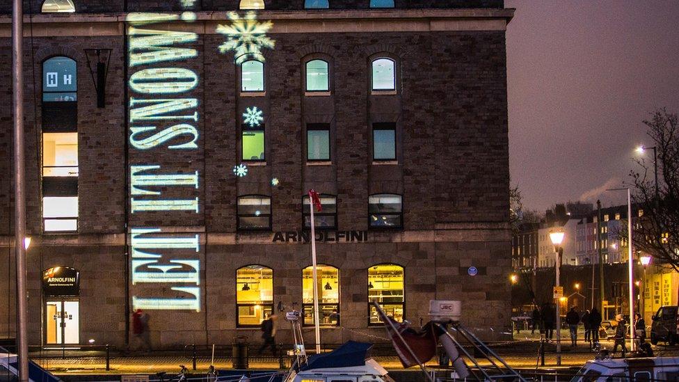 Bristol ADVENTures illumination on the side of the Arnolfini