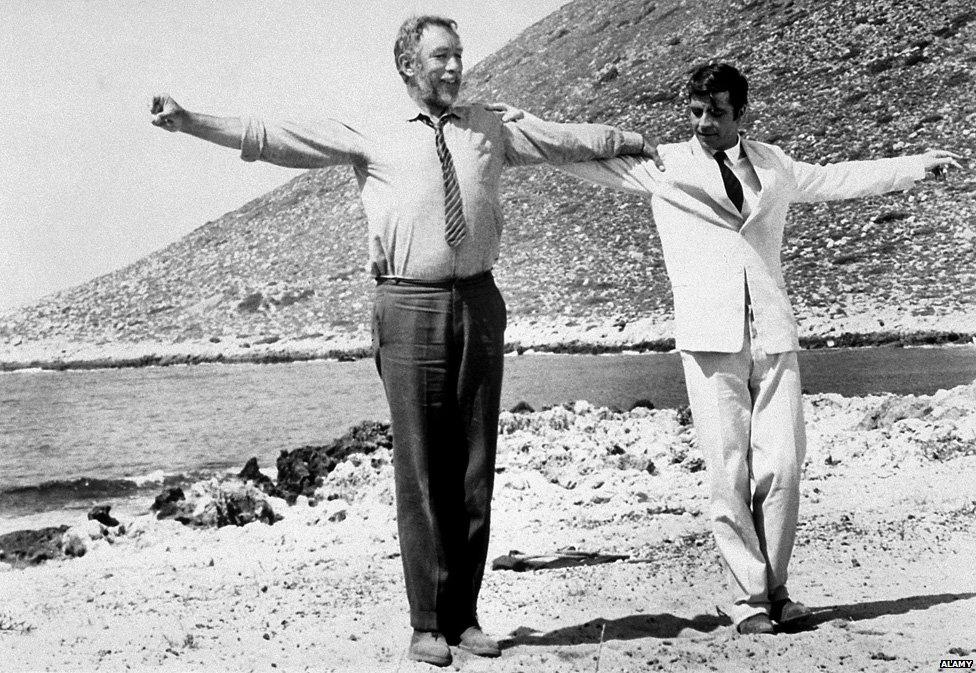 Zorba (Anthony Quinn) teaches Basil (Alan Bates) to dance sirtaki