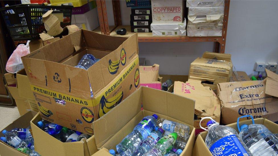 Cardboard boxes of water being prepared by student activists