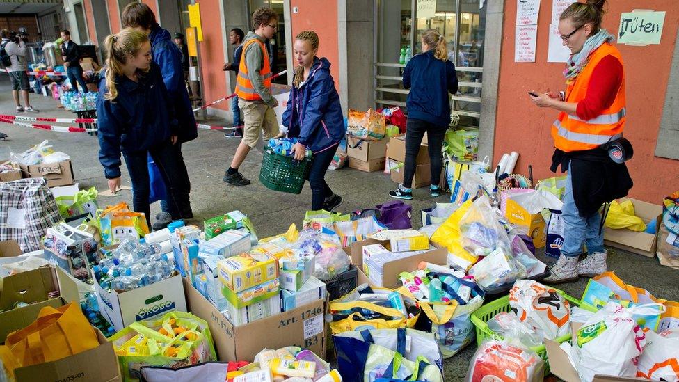 Helpers sort through aid that has been donated for migrants at Munich"s central railway station in Munich, Germany, 02 September 2015.