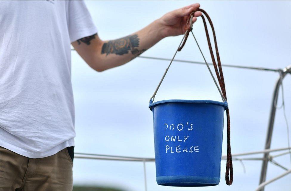 Blue plastic poo bucket