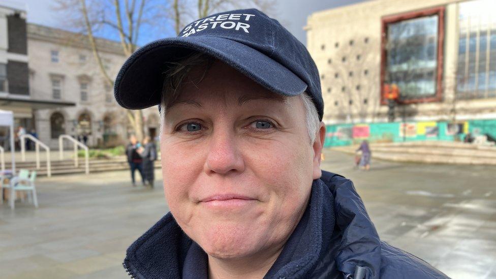 Street pastor Tina Perry standing in Kings Square, Gloucester