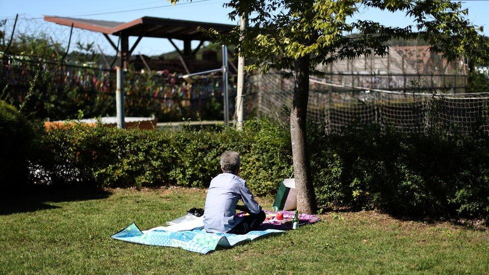 A North Korean defector Ju Young-bok pay respects to his ancestors