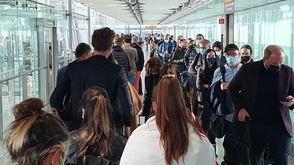 Passengers queue at Heathrow