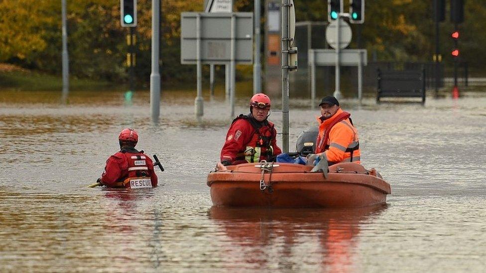 Rescuers using a boat to get around Rotherham