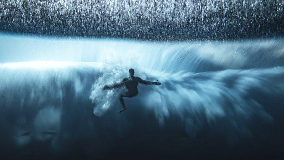 a surfer riding a wave