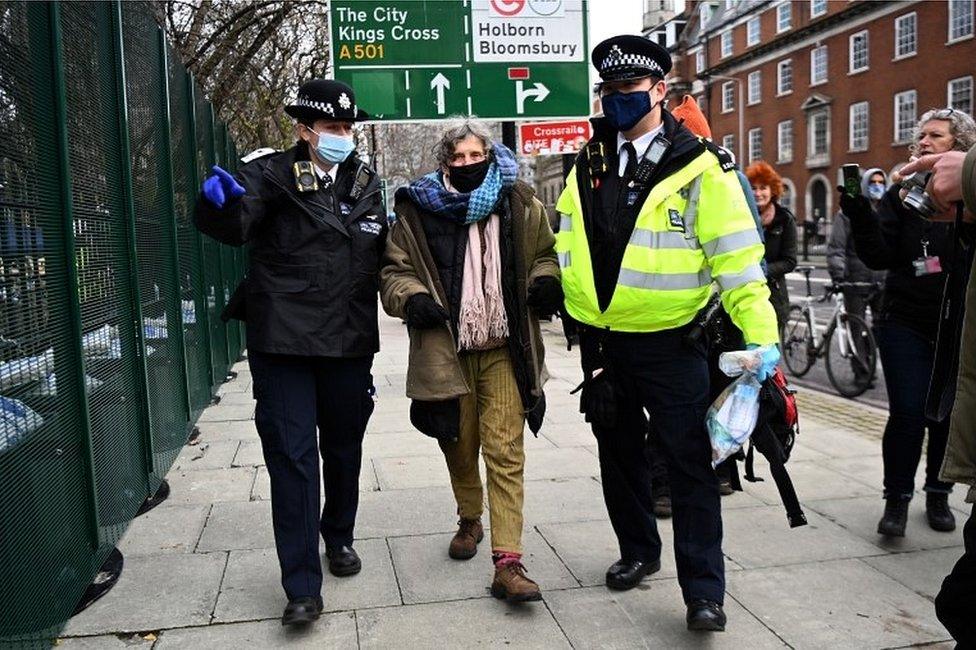 Protester with police