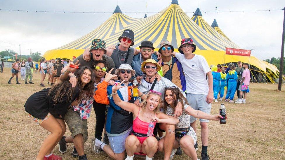 a group of festival goers at the festival ground