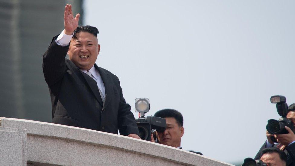 Kim Jong-un waves to the ground