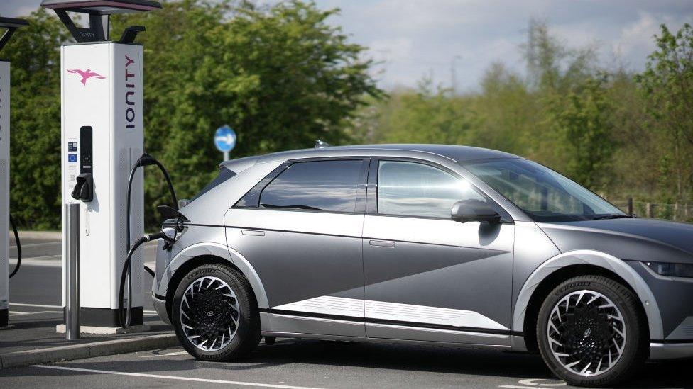 A Hyundai Ioniq battery electric vehicle (BEV) charges at an Ionity GmbH electric car charging station at Skelton Lake motorway service area on April 26, 2022 in Leeds.