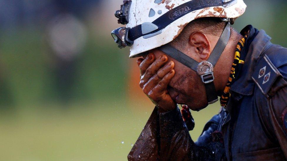 A member of rescue team reacts, upon returning from the mission, after a tailings dam owned by Brazilian mining company Vale SA collapsed