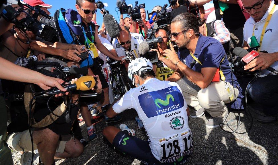 The media scrum surrounds best Colombian rider Nairo Quintana after he wins stage twenty of the 2013 Tour de France