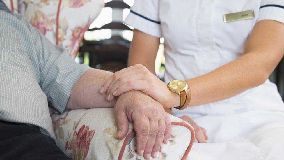 Care worker with patient