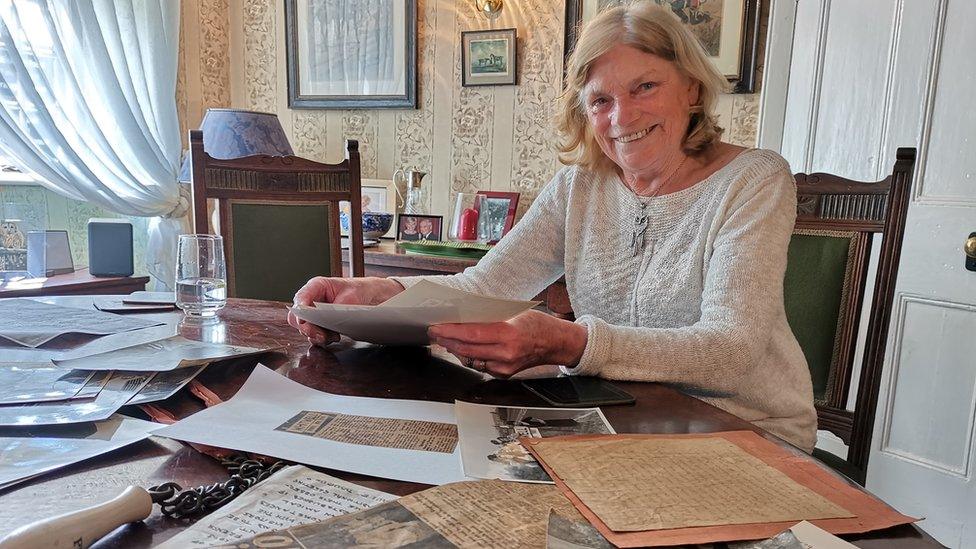 Julie with her memorabilia