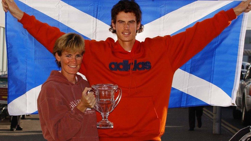 Andrew Murray celebrates his victory in the boys' US Open with his mum Judy on his arrival back in Scotland