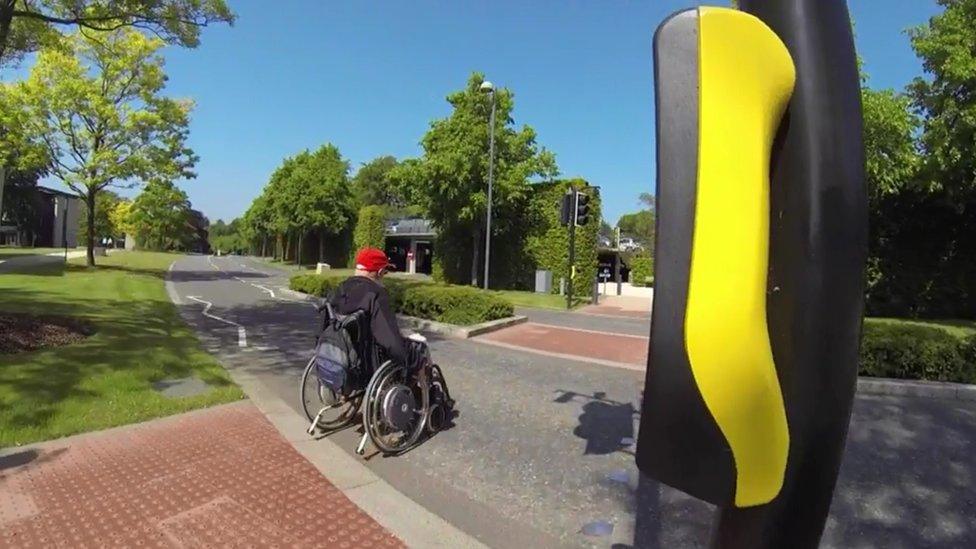 Wheelchair user on pedestrian crossing