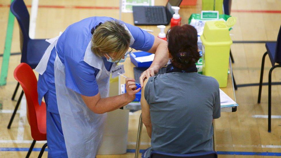 Woman receives Covid vaccination in Cwmbran, Torfaen