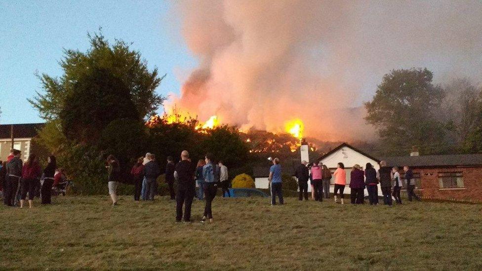 Local residents watched the fire as it approached their homes