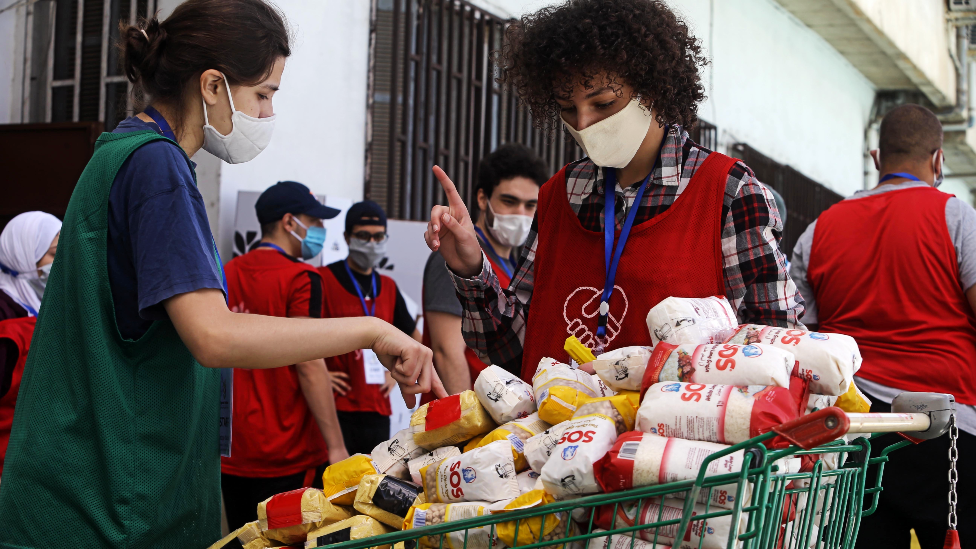 A group of young volunteers prepare food aid in Algiers, Algeria - May 2020