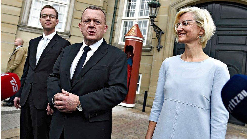 Danish Prime Minister Lars Lokke Rasmussen (C) presents Esben Lunde Larsen as new Environmental and Food Minister (L) and Ulla Tornaes as new Minister of Higher Education and Science in front of Amalienborg Castle in Copenhagen February 29, 2016