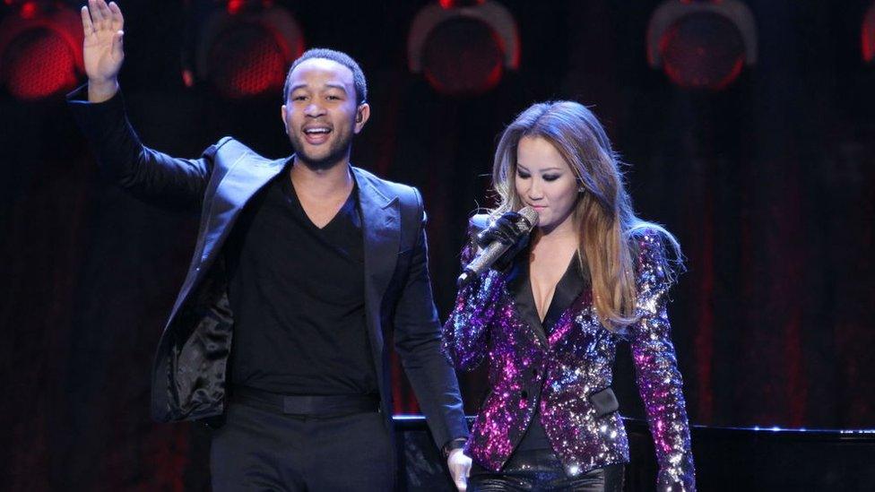 Coco Lee performing with John Legend in 2011 in Beijing