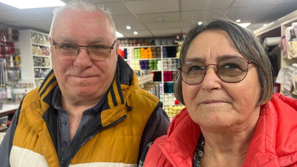 Mick and Valerie Tracey inside Avenue Fabrics shop