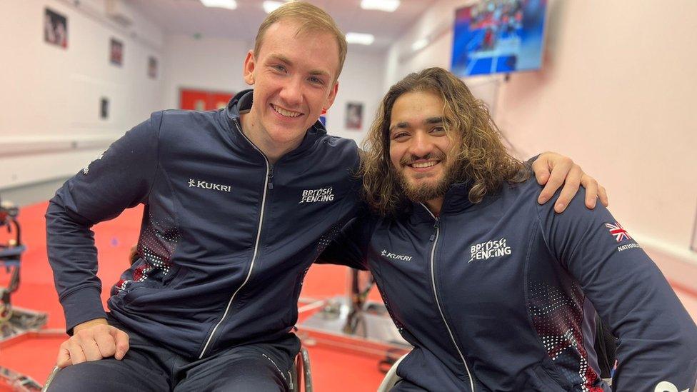 Two wheelchair fencers