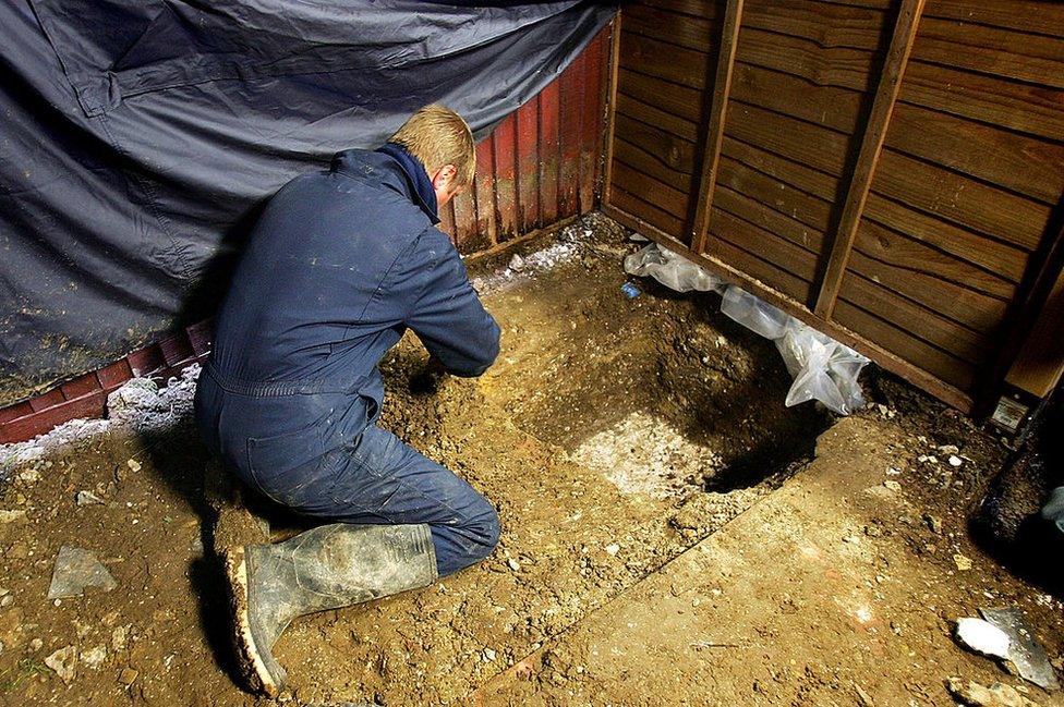 A forensic archaeologist working in the garden of Tobin's former home in Irvin Drive, Margate