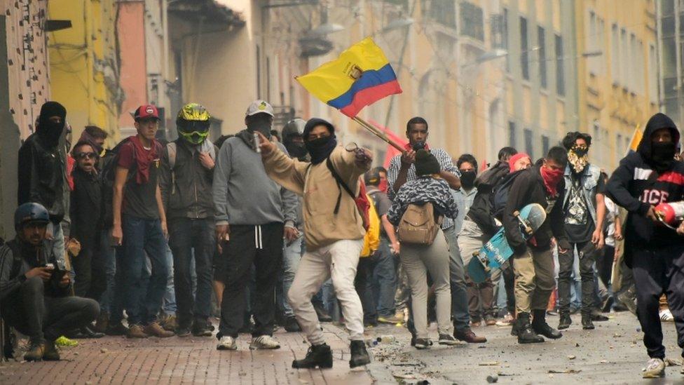 Protesters attend a demonstration against the ending of fuel subsidies in Ecuador