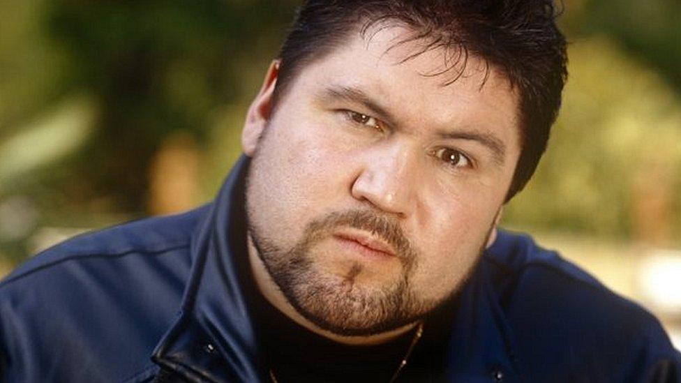 Ricky Grover playing doorman Sean in the BBC sitcom Orrible