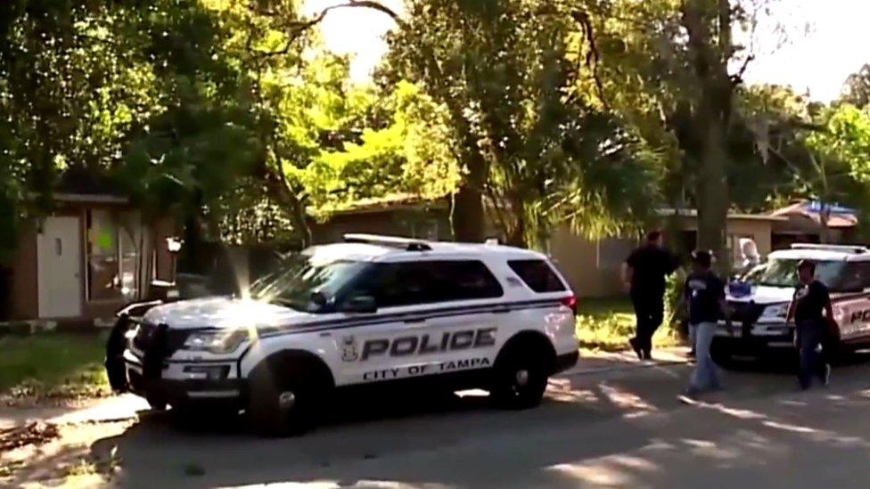 Police cars outside a home