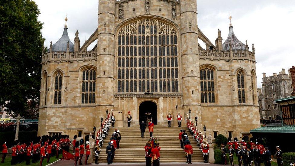 Soldiers walk into St George's chapel in Windsor Castle