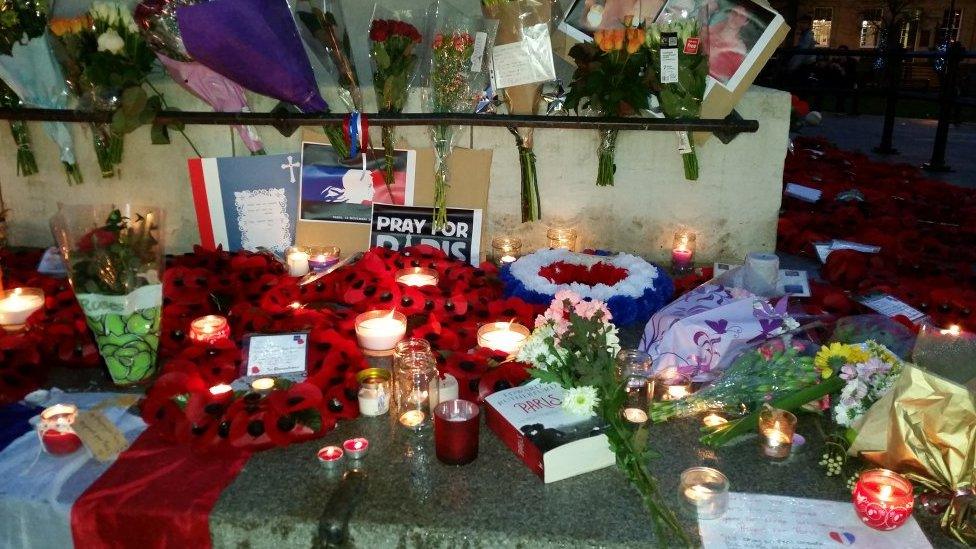 Floral tributes and candles in Newcastle