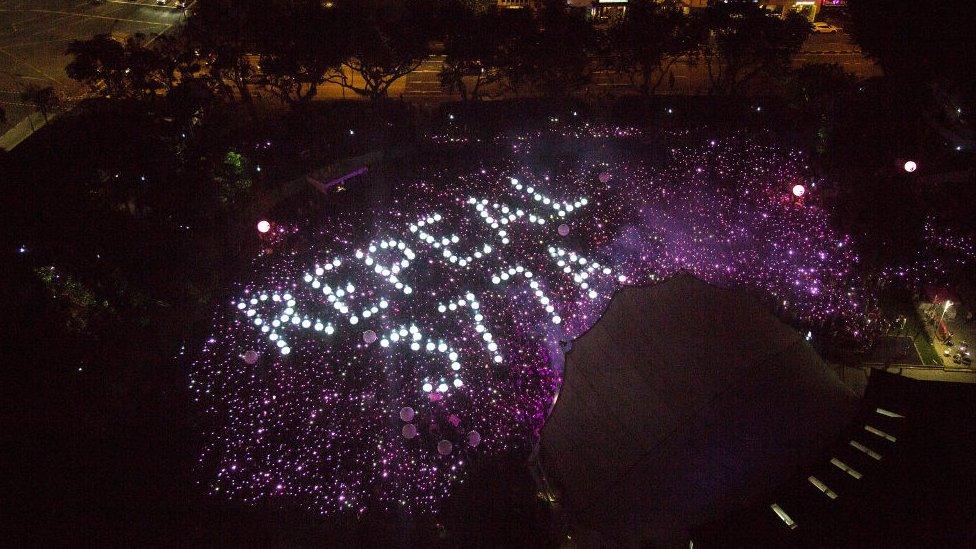 Attendees form the characters Repeal 377A in a call to repeal Section 377A of Singapore's Penal Code which criminalises sex between men during the Pink Dot event held at the Speaker's Corner in Hong Lim Park on June 29, 2019 in Singapore.