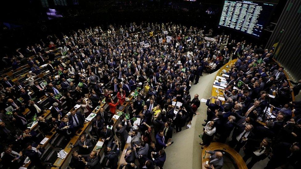 Members of Congress and supporters of the pension reform bill celebrate the vote in the Chamber of Deputies in Brasilia, July 10, 2019