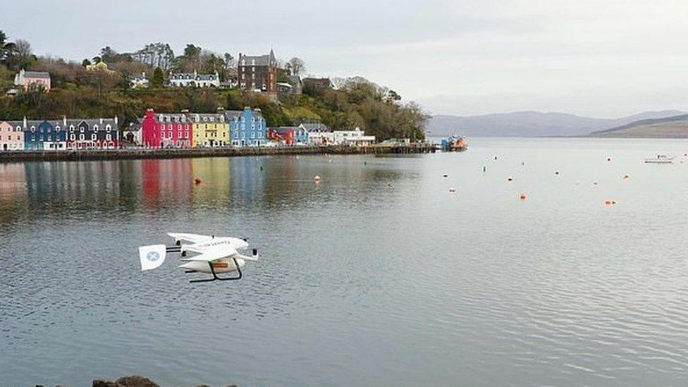 Drone with parcel flying over Mull